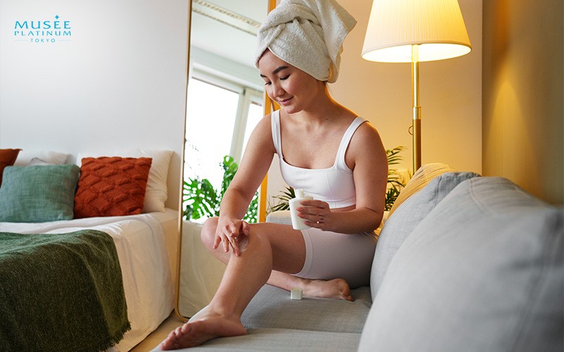 A Lady Applying Moisturiser To Her Legs After MIT Radiance Treatment